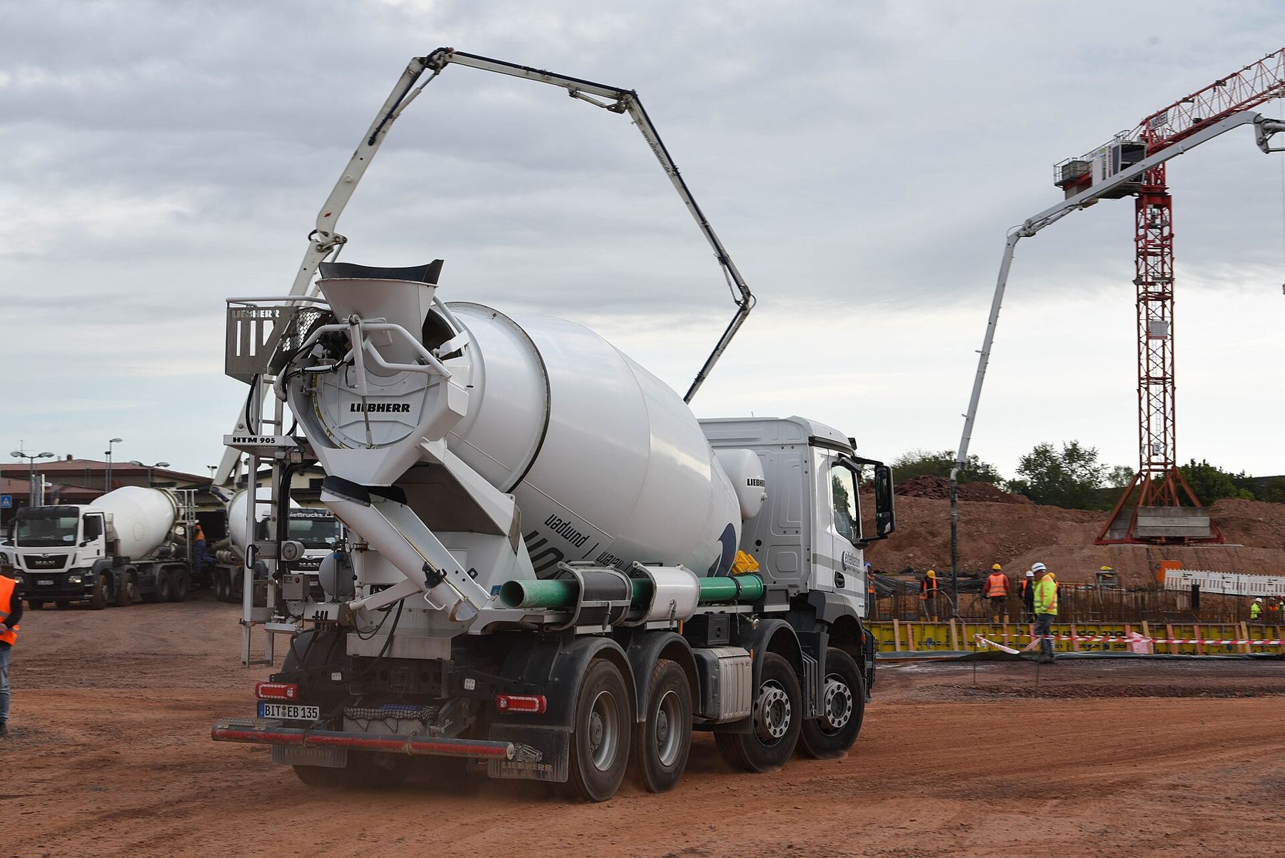 Ready mix concrete truck and pump at a construction site